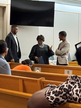 Courtroom with judge speaking to participant